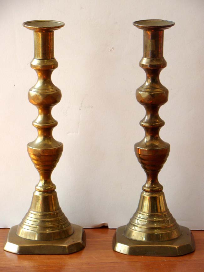 A fine pair of late 19th century English brass beehive form candlesticks